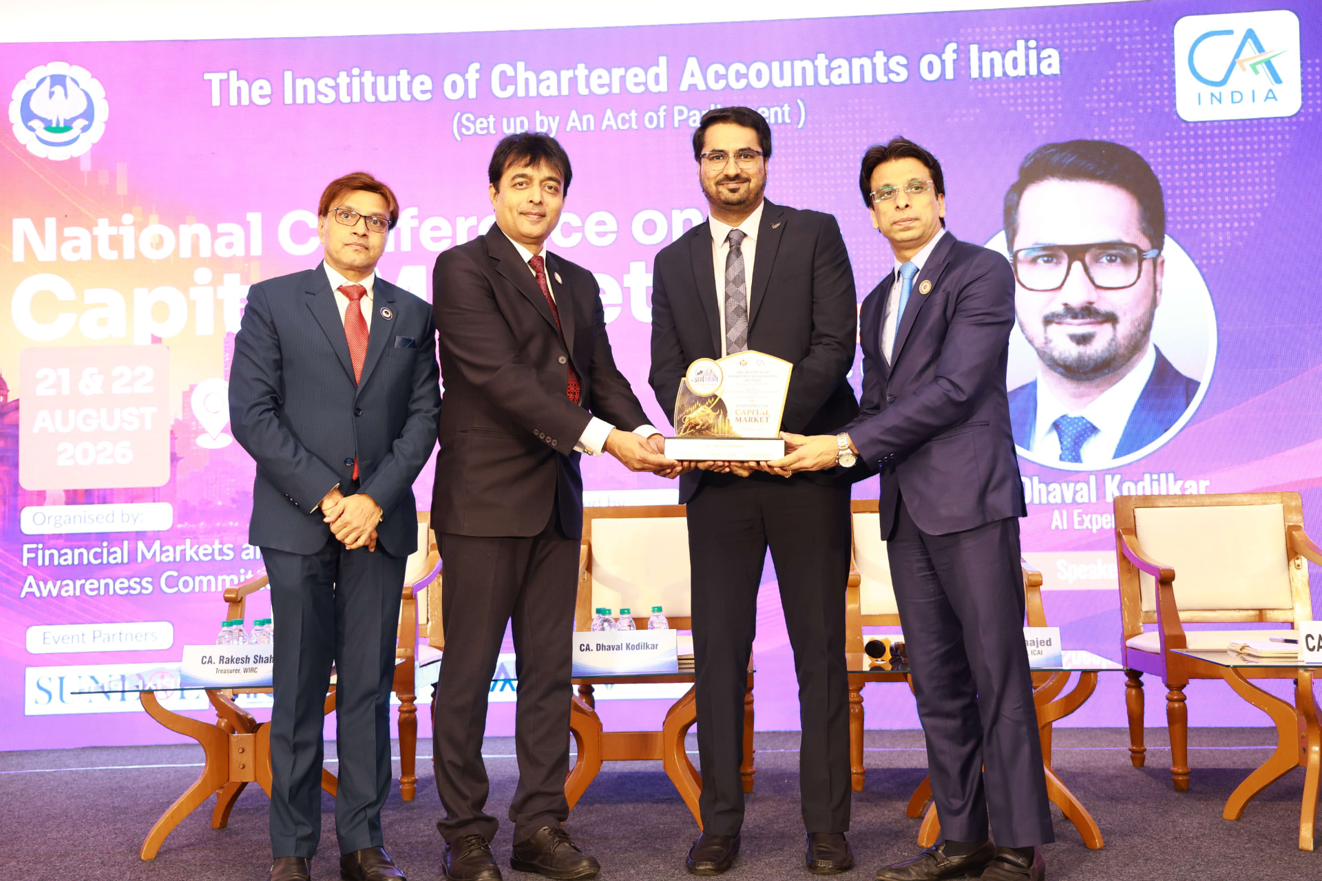 CA Dhaval Kodilkar felicitated with a trophy on stage at the ICAI National Conference on Capital Markets, Mumbai