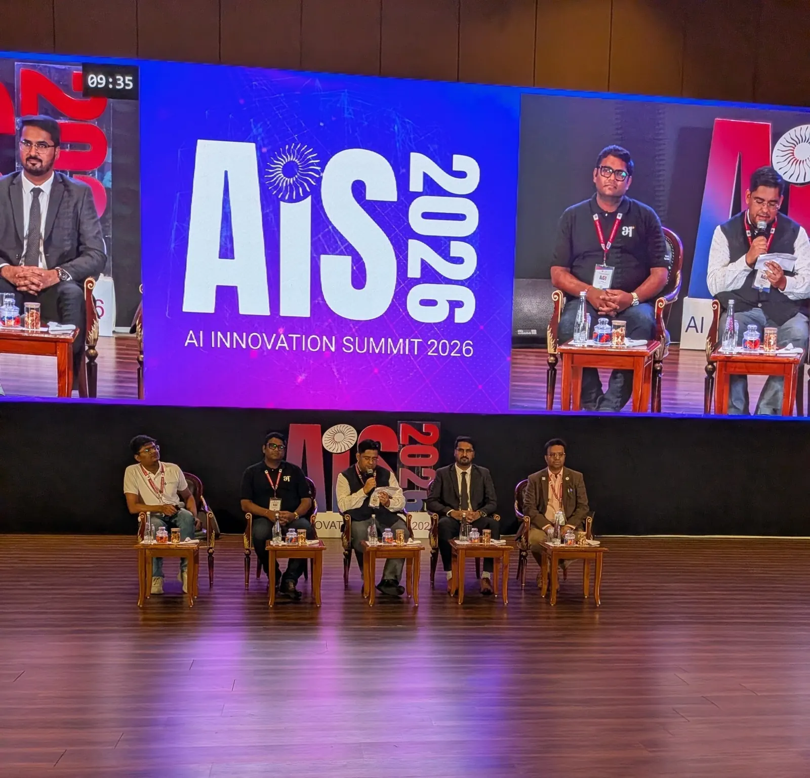 CA Dhaval Kodilkar with panellists on stage at AIS 2026