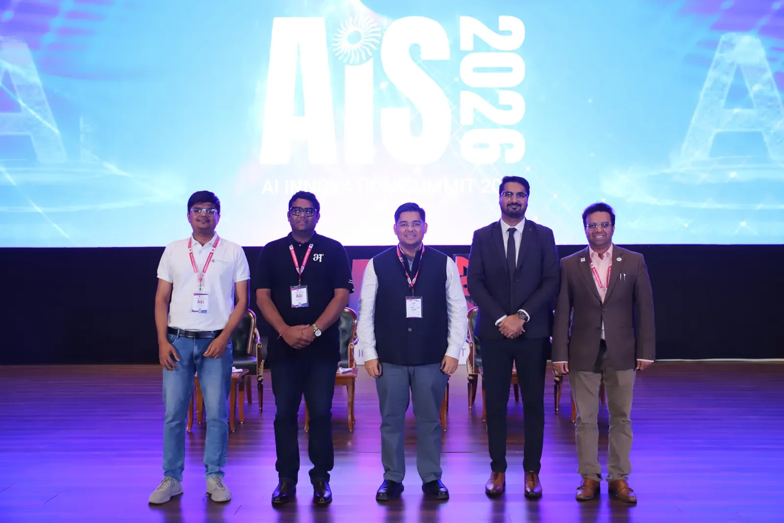 Speakers including CA Dhaval Kodilkar on stage at AIS 2026
