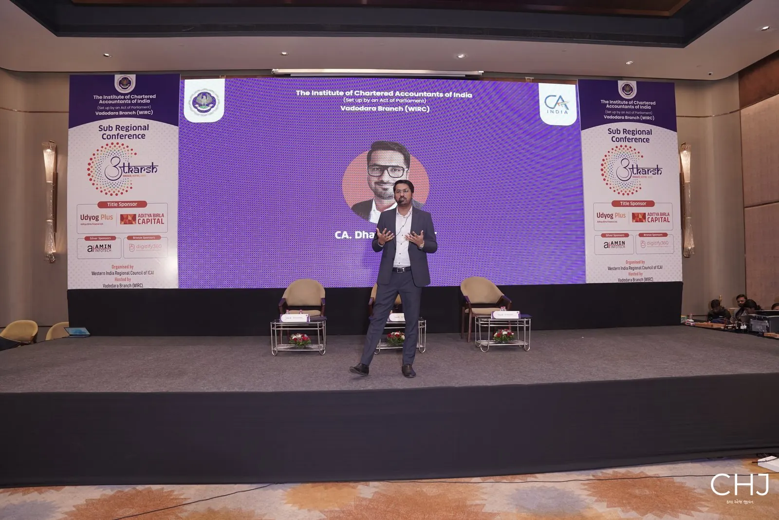 CA Dhaval Kodilkar on stage at the Utkarsh conference, Vadodara